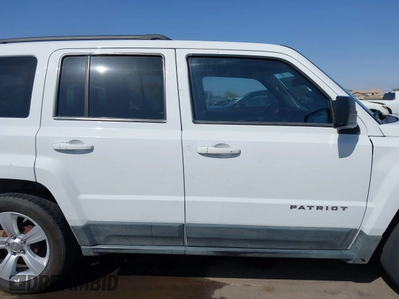 2011 Jeep Patriot Latitude with VIN 1J4NT1GB5BD245263, listed as a IAAI auction lot 41942376 with 215,147 mi miles. Bid and sale history available at carsss.com. Image 13.