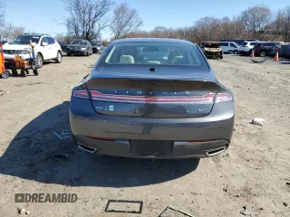2015 Lincoln MKZ z VIN 3LN6L2JK1FR604092, wystawiony jako Copart lot #48379525 z przebiegiem 64 656 mil mil oraz Szkoda całkowita • Salvage title. Historia ofert i sprzedaży dostępna na DreamBid. Obrazek 6.