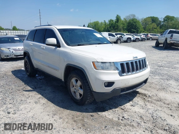 2011 Jeep Grand Cherokee Laredo with VIN 1J4RS4GG5BC573337, listed as a IAAI auction lot 41960369 with 185,518 mi miles and . Bid and sale history available at DreamBid. Image 1.