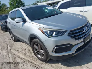 2018 Hyundai Santa Fe 2.4L z VIN 5XYZTDLB9JG513584, wystawiony jako IAAI lot #42031291 z przebiegiem 131 109 mil mil oraz . Historia ofert i sprzedaży dostępna na DreamBid. Obrazek 1.