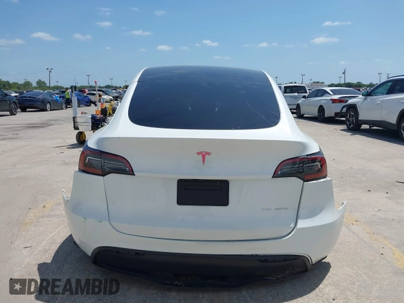2023 Tesla Model Y Long Range with VIN 7SAYGDEE7PF865539, listed as a IAAI auction lot 42109673 with 34,923 mi miles and . Bid and sale history available at DreamBid. Image 16.