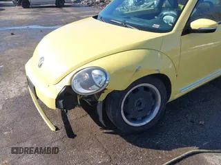 2012 Volkswagen Beetle 2.5L PZEV with VIN 3VWJP7AT9CM610530, listed as a IAAI auction lot 41388728 with 143,909 mi miles. Bid and sale history available at carsss.com. Image 6.