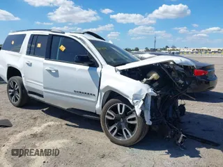 2020 Chevrolet Suburban z VIN 1GNSCJKJ9LR126831, wystawiony jako IAAI lot #41844778 z przebiegiem 107 584 mil mil oraz . Historia ofert i sprzedaży dostępna na DreamBid. Obrazek 1.