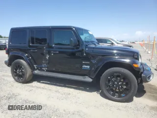 2023 Jeep Wrangler Sahara with VIN 1C4JJXP61PW512975, listed as a Copart auction lot 59392075 with 26,954 mi miles and Salvage title. Bid and sale history available at DreamBid. Image 4.