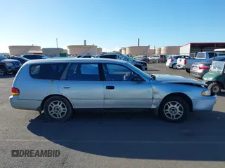 1995 Toyota Camry LE z VIN 4T1GK12W1SU100177, wystawiony jako IAAI lot #41338427 z przebiegiem 128 733 mil mil oraz . Historia ofert i sprzedaży dostępna na DreamBid. Obrazek 12.