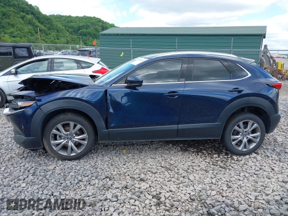 2021 Mazda CX-30 Premium z VIN 3MVDMBDL7MM236474, wystawiony jako IAAI lot #42284515 z przebiegiem 58 565 mil mil oraz . Historia ofert i sprzedaży dostępna na DreamBid. Obrazek 14.
