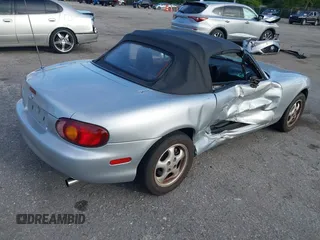 1999 Mazda MX-5 Miata with VIN JM1NB3534X0124237, listed as a IAAI auction lot 42536654 with 92,696 mi miles and . Bid and sale history available at DreamBid. Image 4.