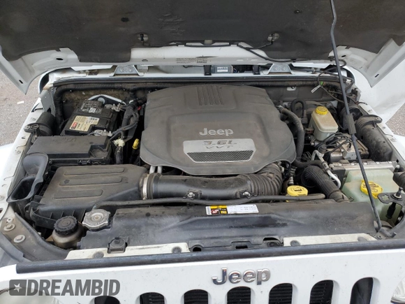 2013 Jeep Wrangler Sahara with VIN 1C4AJWBGXDL579341, listed as a Copart auction lot 55970815 with 105,961 mi miles and Salvage title. Bid and sale history available at DreamBid. Image 12.