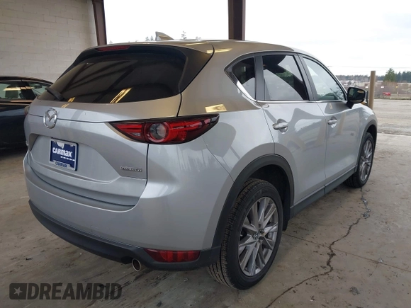 2020 Mazda CX-5 Grand Touring with VIN JM3KFADM0L0738693, listed as a IAAI auction lot 41725906 with 63,629 mi miles. Bid and sale history available at carsss.com. Image 4.