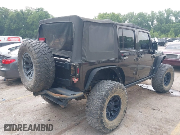 2013 Jeep Wrangler Unlimited Rubicon with VIN 1C4BJWFG5DL652050, listed as a IAAI auction lot 42451954 with 107,110 mi miles and . Bid and sale history available at DreamBid. Image 4.