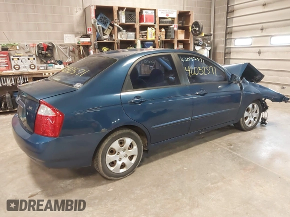 2004 Kia Spectra LX with VIN KNAFE121145012249, listed as a IAAI auction lot 42032571 with 146,748 mi miles. Bid and sale history available at carsss.com. Image 4.