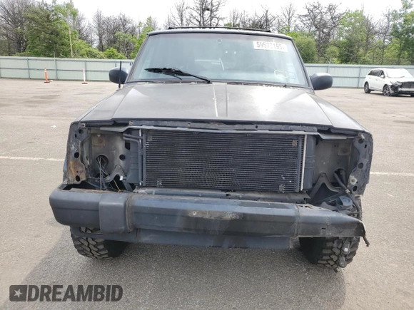 1999 Jeep Cherokee Sport with VIN 1J4FF68S9XL635836, listed as a Copart auction lot 59573195 with 187,035 mi miles and Salvage title. Bid and sale history available at DreamBid. Image 5.