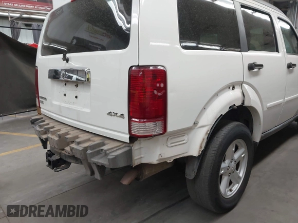 2007 Dodge Nitro SLT with VIN 1D8GU58K97W583408, listed as a IAAI auction lot 41653696 with 124,449 mi miles. Bid and sale history available at carsss.com. Image 6.