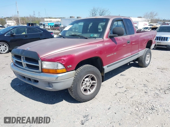 1999 Dodge Dakota SLT z VIN 1B7GL22X2XS222162, wystawiony jako IAAI lot #42038943 z przebiegiem 222 883 mil mil oraz . Historia ofert i sprzedaży dostępna na DreamBid. Obrazek 2.