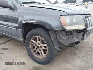 2004 Jeep Grand Cherokee Laredo with VIN 1J4GX48S34C214485, listed as a IAAI auction lot 42208120 with 164,322 mi miles and . Bid and sale history available at DreamBid. Image 12.