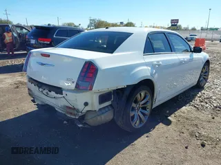 2014 Chrysler 300 with VIN 2C3CCABG9EH286541, listed as a IAAI auction lot 40828693 with 143,343 mi miles. Bid and sale history available at carsss.com. Image 4.