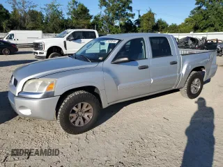 2008 Mitsubishi Raider LS z VIN 1Z7HC28KX8S588361, wystawiony jako Copart lot #74239144 z przebiegiem 85 128 mil mil oraz Czysty tytuł • Clean title. Historia ofert i sprzedaży dostępna na DreamBid. Obrazek 1.
