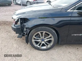 2019 Ford Fusion Hybrid Titanium with VIN 3FA6P0RU4KR144445, listed as a IAAI auction lot 42059840 with 90,617 mi miles. Bid and sale history available at carsss.com. Image 19.