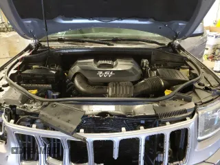 2014 Jeep Grand Cherokee Laredo with VIN 1C4RJFAG8EC150477, listed as a Copart auction lot 89332515 with 189,914 mi miles and Salvage Title. Bid and sale history available at DreamBid. Image 12.