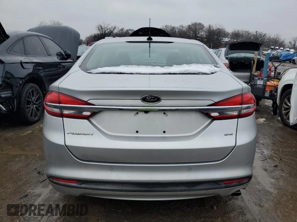 2018 Ford Fusion SE z VIN 3FA6P0H79JR270777, wystawiony jako Copart lot #45319755 z przebiegiem 69 152 mil mil oraz Szkoda całkowita • Salvage title. Historia ofert i sprzedaży dostępna na DreamBid. Obrazek 6.