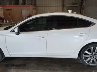 2021 Mazda 6 Carbon Edition with VIN JM1GL1WY9M1614117, listed as a IAAI auction lot 41305576 with 54,670 mi miles and . Bid and sale history available at DreamBid. Image 14.