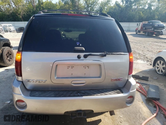 2005 GMC Envoy SLE z VIN 1GKDT13S552122428, wystawiony jako Copart lot #68651224 z przebiegiem 111 931 mil mil oraz Szkody całkowita. Historia ofert i sprzedaży dostępna na DreamBid. Obrazek 6.