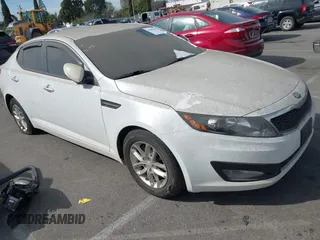 2013 Kia Optima LX with VIN 5XXGM4A79DG193534, listed as a IAAI auction lot 41690584 with 100,287 mi miles. Bid and sale history available at carsss.com. Image 1.