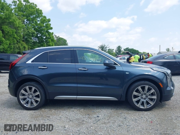 2019 Cadillac XT4 FWD Premium Luxury z VIN 1GYFZCR43KF143980, wystawiony jako IAAI lot #42472400 z przebiegiem 36 496 mil mil oraz . Historia ofert i sprzedaży dostępna na DreamBid. Obrazek 13.