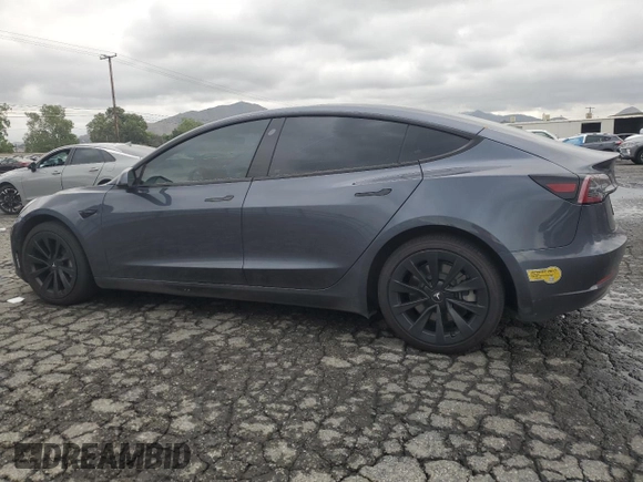 2022 Tesla Model 3 Long Range with VIN 5YJ3E1EB9NF117339, listed as a Copart auction lot 55659415 with 87,479 mi miles and Salvage Title. Bid and sale history available at DreamBid. Image 2.