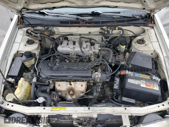 1996 Nissan Sentra XE z VIN 1N4AB41D2TC767557, wystawiony jako Copart lot #42553245 z przebiegiem 148 514 mil mil oraz Szkoda całkowita • Salvage title. Historia ofert i sprzedaży dostępna na DreamBid. Obrazek 13.