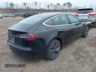 2019 Tesla Model 3 Mid Range with VIN 5YJ3E1EA2KF395549, listed as a IAAI auction lot 41895977 with 97,108 mi miles and . Bid and sale history available at carsss.com. Image 4.