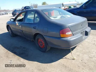 1999 Nissan Altima XE with VIN 1N4DL01D0XC116467, listed as a IAAI auction lot 41705684 with 227,999 mi miles. Bid and sale history available at carsss.com. Image 3.