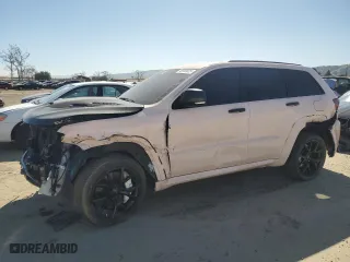 2021 Jeep Grand Cherokee SRT with VIN 1C4RJFDJ7MC798933, listed as a Copart auction lot 46900605 with 59,161 mi miles and Salvage Title. Bid and sale history available at carsss.com. Image 1.