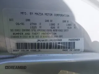 1991 Mazda MX-5 Miata Special Edition z VIN JM1NA3511M1235948, wystawiony jako IAAI lot #42322754 z przebiegiem 151 065 mil mil oraz . Historia ofert i sprzedaży dostępna na DreamBid. Obrazek 9.