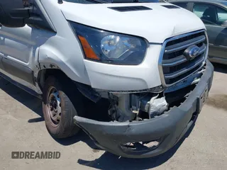 2020 Ford Transit Cargo z VIN 1FTBW3X89LKB72069, wystawiony jako IAAI lot #42623407 z przebiegiem 454 279 mil mil oraz . Historia ofert i sprzedaży dostępna na DreamBid. Obrazek 6.