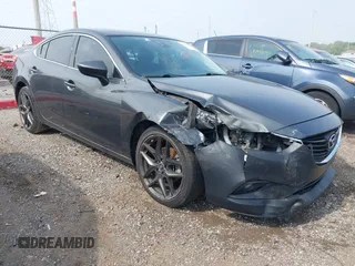 2014 Mazda 6 i Grand Touring with VIN JM1GJ1W6XE1124890, listed as a IAAI auction lot 42469664 with 149,314 mi miles and . Bid and sale history available at DreamBid. Image 1.