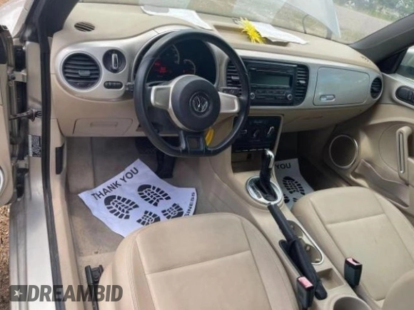 2013 Volkswagen Beetle 2.5L with VIN 3VW5X7AT2DM825928, listed as a Copart auction lot 66500855 with 48,795 mi miles and Salvage title. Bid and sale history available at DreamBid. Image 9.
