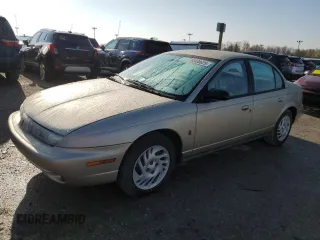 1999 Saturn SL z VIN 1G8ZK5273XZ214036, wystawiony jako Copart lot #52038625 z przebiegiem 211 827 mil mil oraz Szkoda całkowita • Salvage title. Historia ofert i sprzedaży dostępna na DreamBid. Obrazek 1.