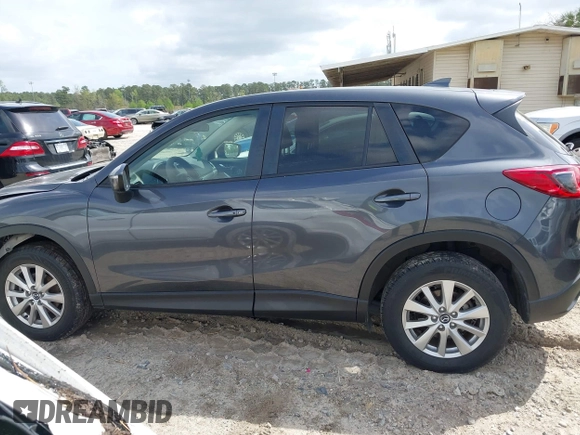 2016 Mazda CX-5 Touring with VIN JM3KE2CYXG0647921, listed as a IAAI auction lot 41948068 with 133,733 mi miles and . Bid and sale history available at DreamBid. Image 14.