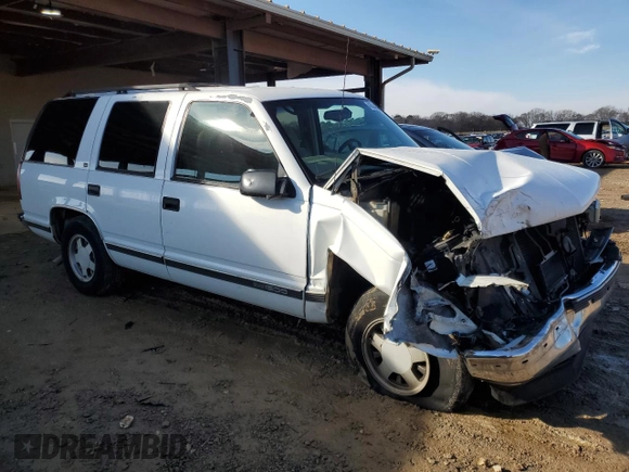 1999 GMC Yukon with VIN 1GKEC13R0XJ811710, listed as a Copart auction lot 43014995 with 311,948 mi miles and Salvage Title. Bid and sale history available at carsss.com. Image 4.