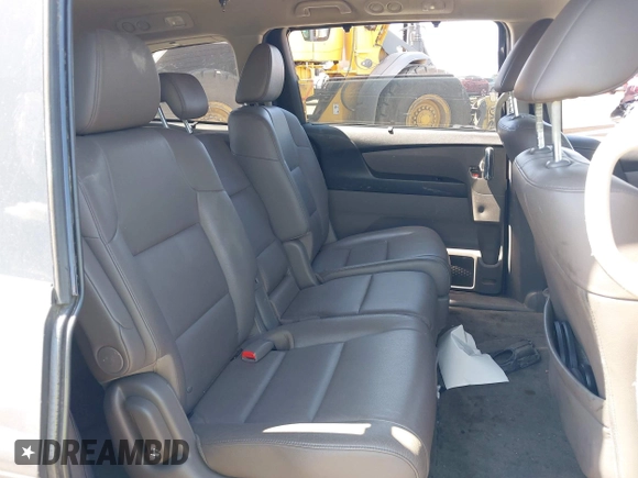 2014 Honda Odyssey Touring with VIN 5FNRL5H90EB082691, listed as a IAAI auction lot 42572977 with 54,413 mi miles and . Bid and sale history available at DreamBid. Image 8.