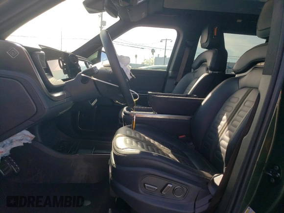 2024 Rivian R1S Adventure z VIN 7PDSGABA6RN033514, wystawiony jako Copart lot #89296455 z przebiegiem Nie podano mil oraz Szkody całkowita. Historia ofert i sprzedaży dostępna na DreamBid. Obrazek 7.