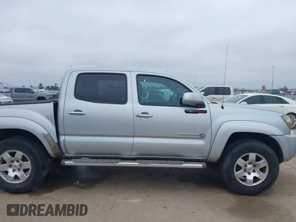 2009 Toyota Tacoma PreRunner with VIN 3TMJU62NX9M081748, listed as a IAAI auction lot 41608525 with 210,999 mi miles. Bid and sale history available at carsss.com. Image 13.