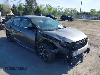 2017 Nissan Maxima SR z VIN 1N4AA6AP1HC387058, wystawiony jako IAAI lot #42112287 z przebiegiem 128 460 mil mil oraz . Historia ofert i sprzedaży dostępna na DreamBid. Obrazek 1.