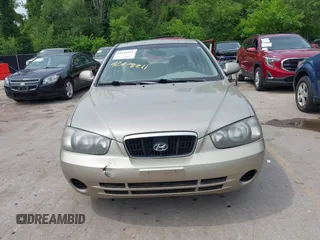 2003 Hyundai Elantra GLS z VIN KMHDN45D73U556305, wystawiony jako IAAI lot #42478211 z przebiegiem 149 648 mil mil oraz . Historia ofert i sprzedaży dostępna na DreamBid. Obrazek 6.
