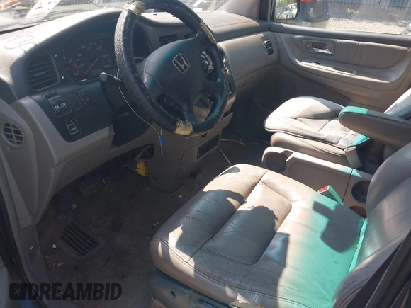 2003 Honda Odyssey EX-L with VIN 5FNRL18003B042487, listed as a IAAI auction lot 42604399 with 188,126 mi miles and . Bid and sale history available at DreamBid. Image 5.