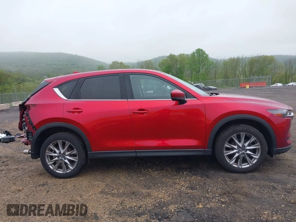 2020 Mazda CX-5 Grand Touring with VIN JM3KFBDM7L1731837, listed as a IAAI auction lot 42160795 with 63,826 mi miles and . Bid and sale history available at DreamBid. Image 14.