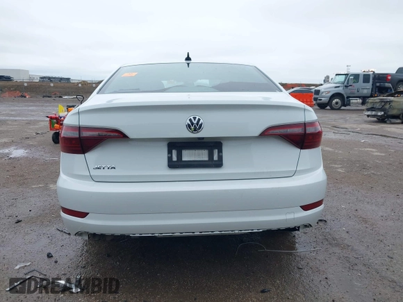2021 Volkswagen Jetta S z VIN 3VWC57BUXMM017430, wystawiony jako IAAI lot #41947038 z przebiegiem 50 277 mil mil oraz . Historia ofert i sprzedaży dostępna na DreamBid. Obrazek 17.