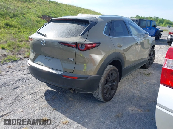 2024 Mazda CX-30 Carbon Edition with VIN 3MVDMBXY6RM649856, listed as a IAAI auction lot 41488913 with 7,350 mi miles and . Bid and sale history available at DreamBid. Image 4.