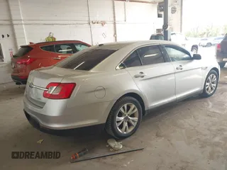 2011 Ford Taurus SEL with VIN 1FAHP2EW6BG170287, listed as a IAAI auction lot 42191702 with 199,477 mi miles. Bid and sale history available at carsss.com. Image 4.